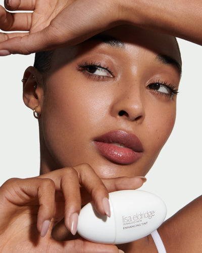 howtouse model holding skin tint for glycerine blog post