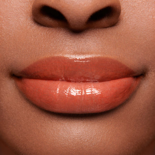 Image showing Dragon - Marilyn Monroe Edition (Gloss Embrace Lip Gloss) on model