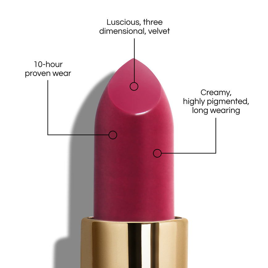 True Velvet Lip Colour bullet close-up, with text demonstrating it's benefits: Lucious, three dimensional, velvet. 10-hour proven wear. Creamy, highly pigmented, long wearing. In shade Carnival.