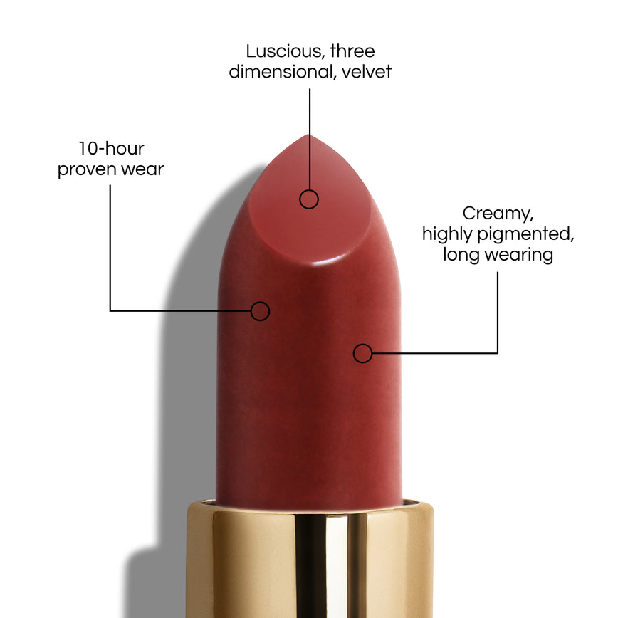True Velvet Lip Colour bullet close-up, with text demonstrating it's benefits: Lucious, three dimensional, velvet. 10-hour proven wear. Creamy, highly pigmented, long wearing. In shade Enchantment.