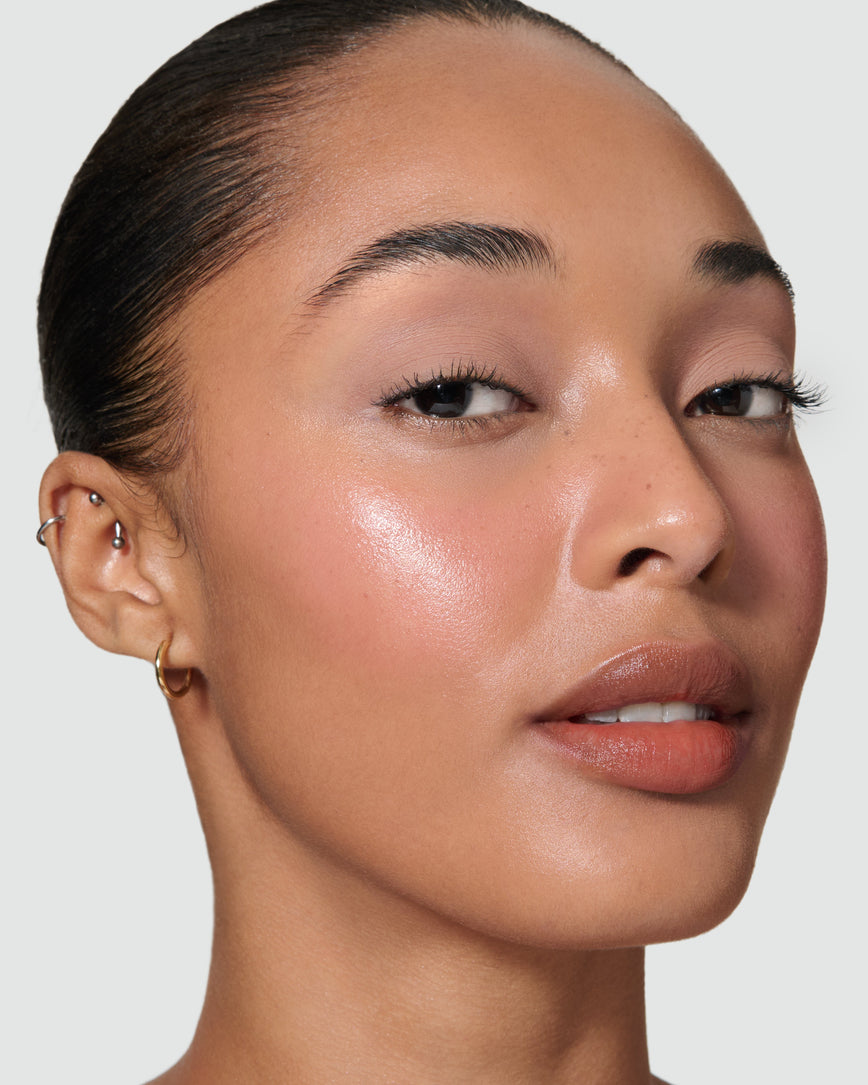 Close up of a model wearing Silvia Liquid Silk Eyeshadow on a neutral background