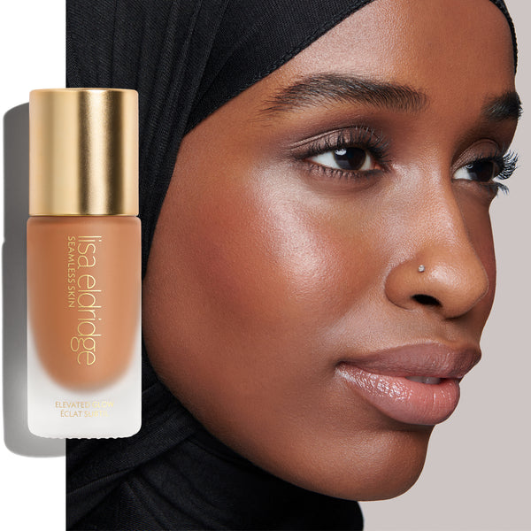 Model with Elevated Glow Highlighter on, with product pack in the foreground.