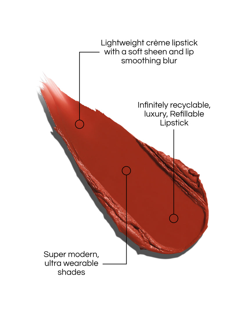 Rouge Experience Lipstick swatch with text describing features on a white background, in shade Lili. Text reads: Lightweight creme lipstick with a soft sheen and lip smoothing blur. Infinitely recyclable, luxury, Refillable Lipstick. Super modern, ultra wearable shades.