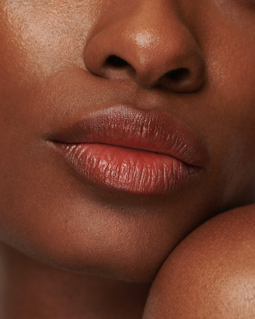 red lip red curve baume embrace containing wild mango kernel butter for lip benefits on model