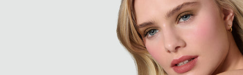 Model wearing a khaki Liquid Silk Liquid Eyeshadow, on a neutral background