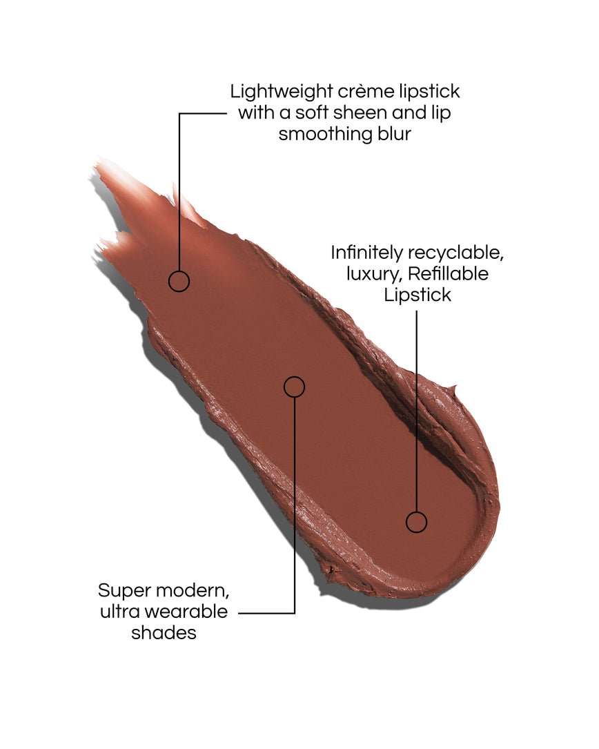 Rouge Experience Lipstick swatch with text describing features on a white background, in shade Rae. Text reads: Lightweight creme lipstick with a soft sheen and lip smoothing blur. Infinitely recyclable, luxury, Refillable Lipstick. Super modern, ultra wearable shades.