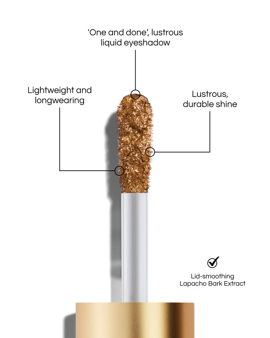 Liquid Lurex Eyeshadow applicator tip with text highlighting features: 'One and done', lustrous liquid eyeshadow. Lightweight and longwearing. Lustrous, durable shine. Lid-smoothing Lapacho Bark Extract. In shade Titania.