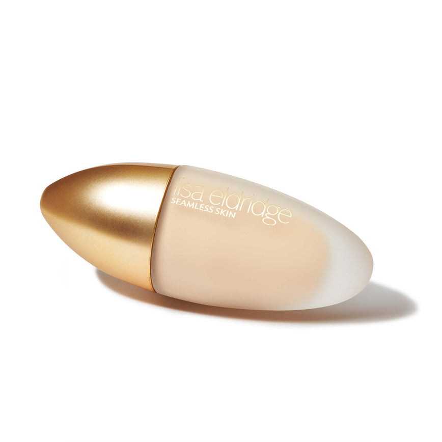 Lisa Eldridge Seamless Skin Foundation in a matte glass bottle with a gold lid. The bottle says ‘lisa eldridge SEAMLESS SKIN’