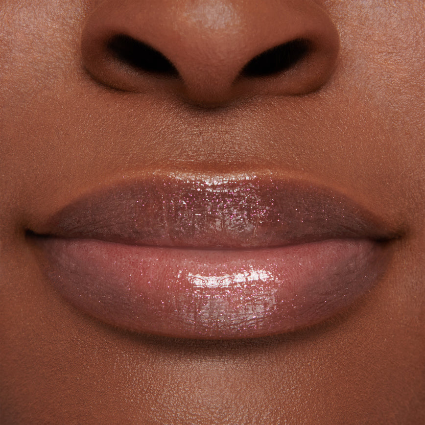 model wearing Gloss Embrace Lip Gloss in shade Dancing Rose
