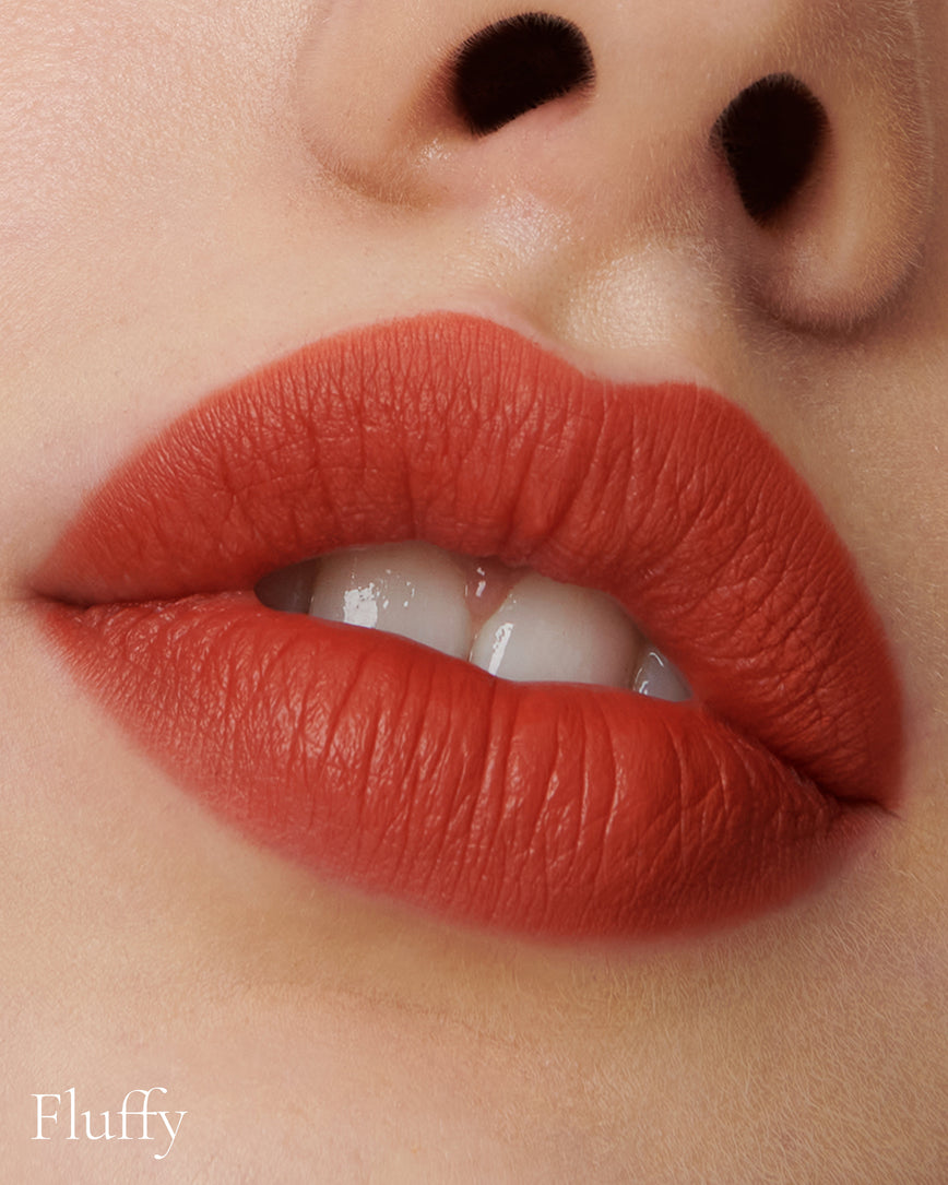 Lisa Eldridge Velveteen Liquid Lipstick in shade Dragon pictured on model
