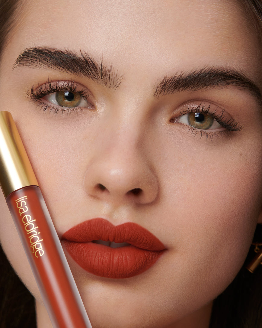 Lisa Eldridge Velveteen Liquid Lipstick in shade Dragon pictured on model