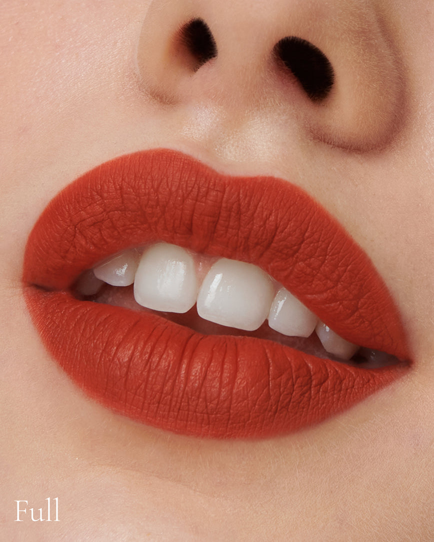 Lisa Eldridge Velveteen Liquid Lipstick in shade Dragon pictured on model