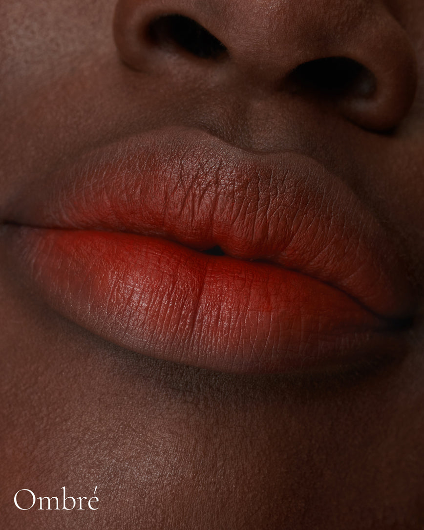 Lisa Eldridge Velveteen Liquid Lipstick in shade Dragon pictured on model