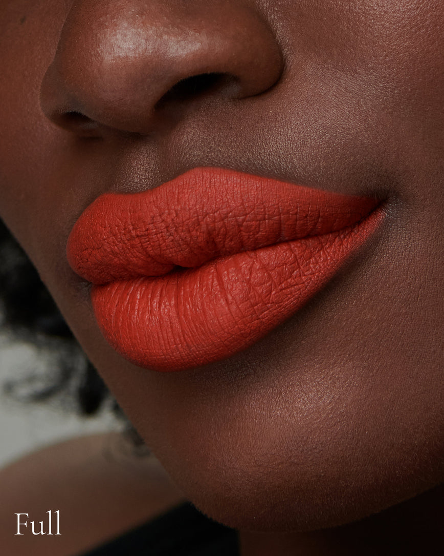 Lisa Eldridge Velveteen Liquid Lipstick in shade Dragon pictured on model