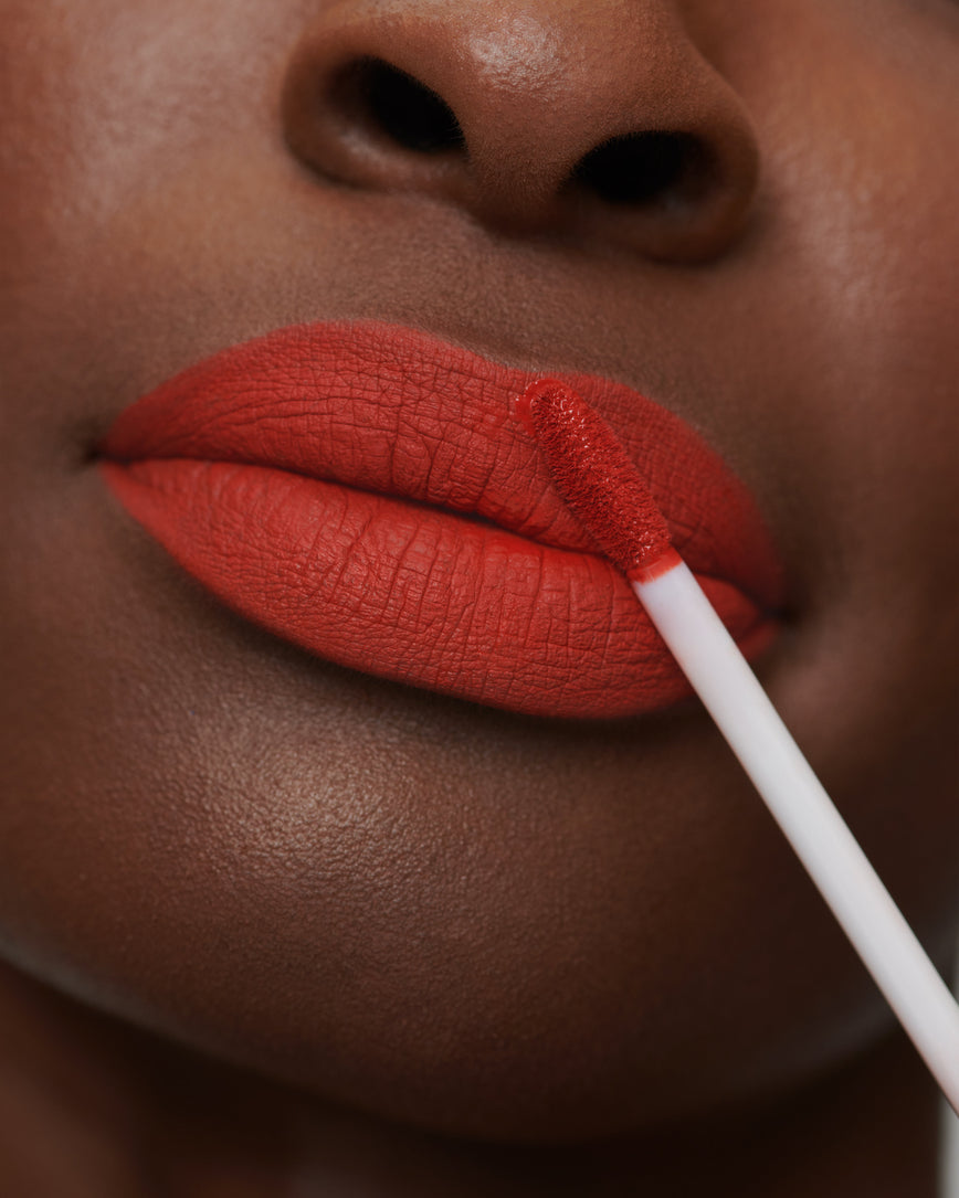 Lisa Eldridge Velveteen Liquid Lipstick in shade Dragon pictured on model