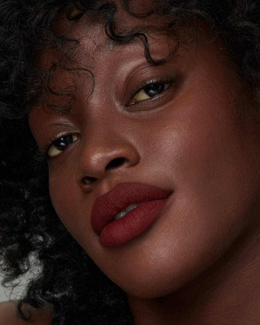 Lisa Eldridge Velveteen Liquid Lipstick in shade Jazz pictured on model