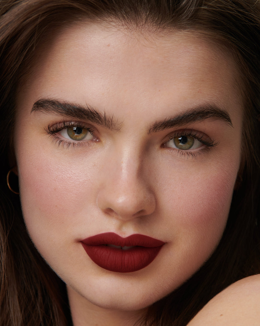 Lisa Eldridge Velveteen Liquid Lipstick in shade Jazz pictured on model